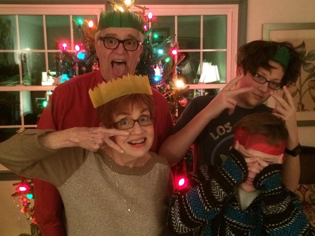 Family in front of Christmas tree